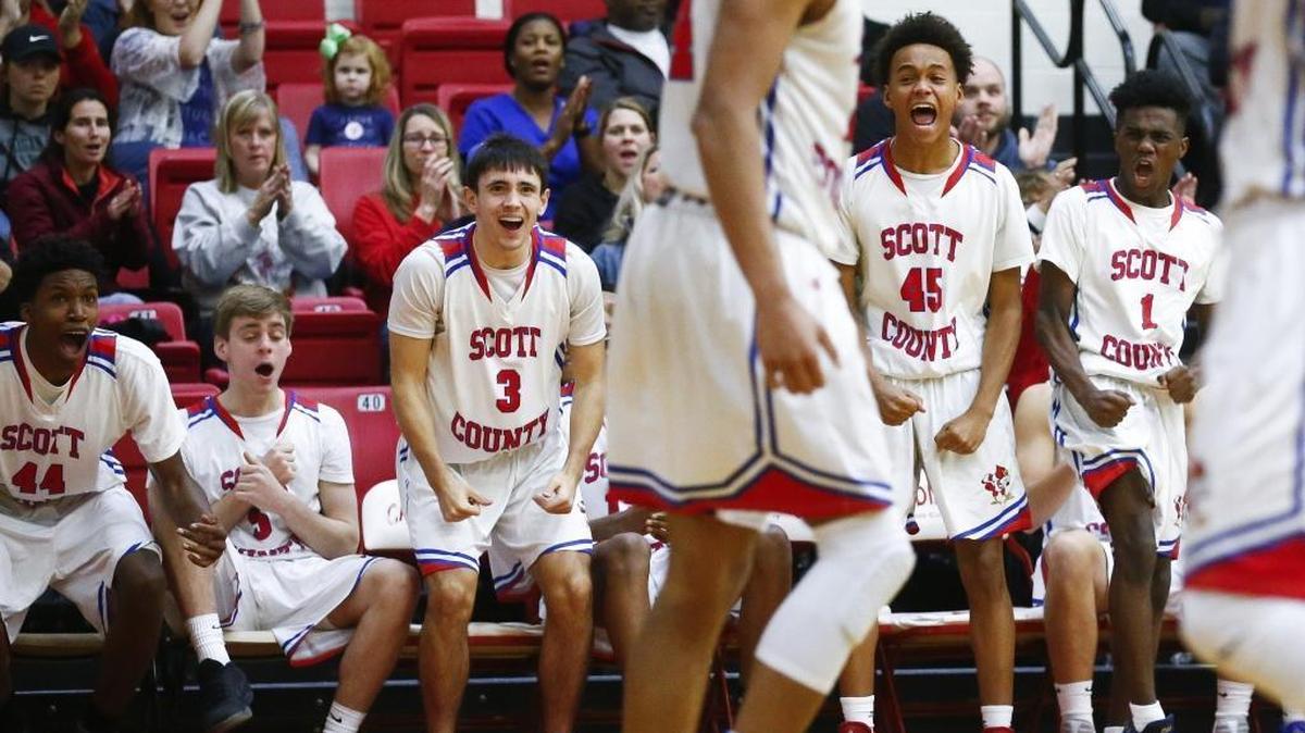 Scott County's Jaylen Barber (44) Michael Mckenzie (5) KJ Tucker (3) Kobi Harris (45) and Cam Fluker (1) celebrate a basket from Scott County's Michael Moreno (24) during their game at Scott County High School in Georgetown, Ky., Thursday, Dec. 7, 2017. Scott County beat Lexington Christian 68-59.