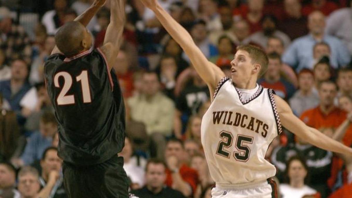 PRP’s JaJuan Spillman shot a three-pointer over Jon Elrod of Pendleton County during the 2005 Sweet Sixteen in Rupp Arena. PRP won 64-61 in overtime.