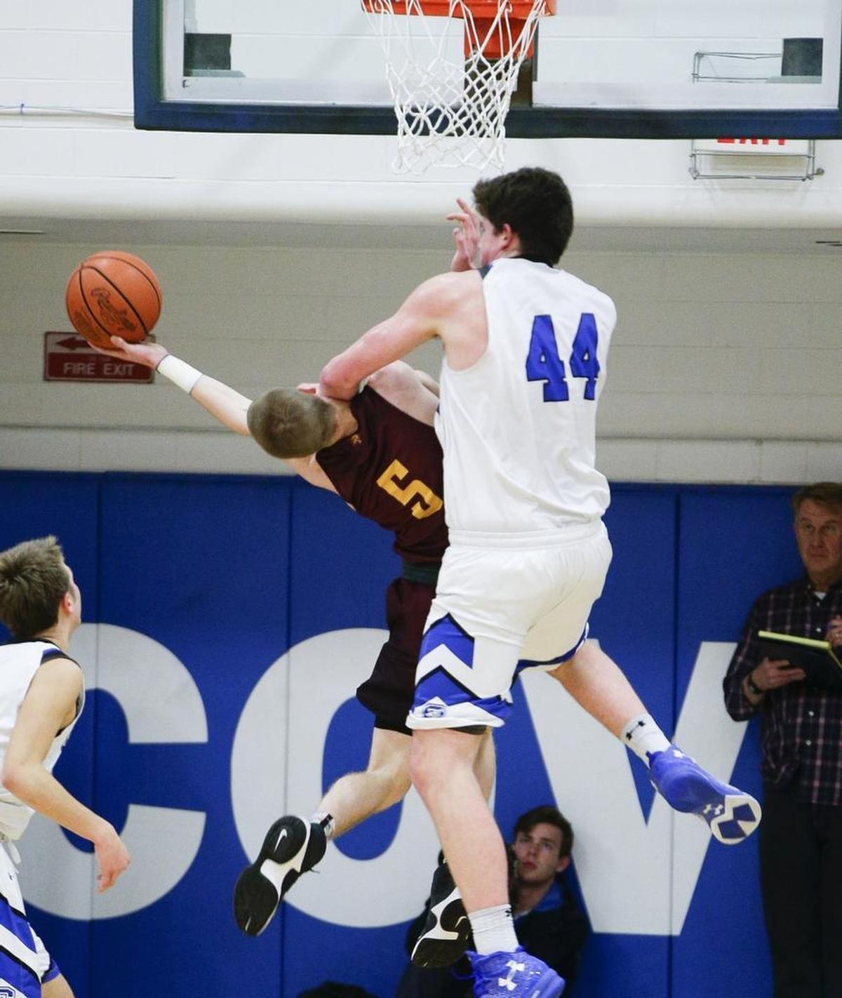 CovCath's Jake Walter put a hard foul on Coopers Adam Kunkel, 5, as Covington Catholic hosted Cooper on Wednesday January 18, 2017 in Park Hills, Ky.