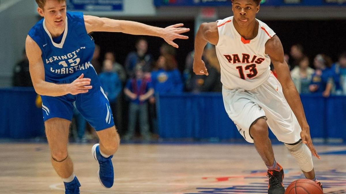 Paris' Marcus Ashford blew past Lexington Christian's Chandler Stewart during the first quarter of their All "A" semifinals match at the Frankfort Convention Center in Frankfort, Kentucky.