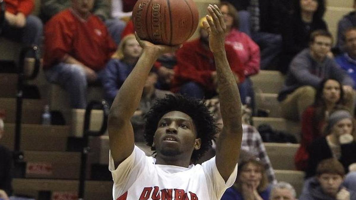 Paul Laurence Dunbar's Taveion Hollingsworth shoots against Scott Co. in the S. T. Roach Gymnasium in Lexington, Ky., Thursday, February 17, 2017.