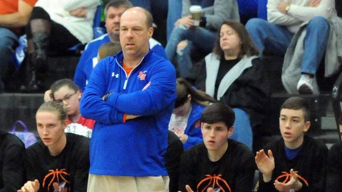 Southwestern boys’ basketball coach Chris Baker (blue) coached his team against Mercer County in the 12th Region finals on March 6, 2018.
