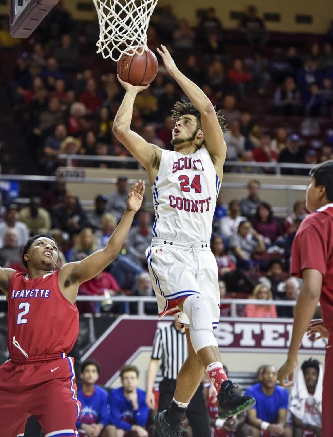 Scott County's Michael Moreno (24) shoots over Lafayette's Evan Dreux (2), during the semi finals of the boys 11th Region tournament, Saturday, March 3, 2018, at EKU's McBrayer Arena in Richmond.