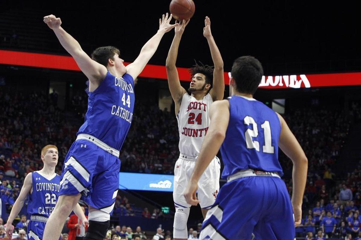 Scott County's Michael Moreno shot Sunday against Covington Catholic's Jake Walter in the championship game of the 2018 Whitaker Bank KHSAA Sweet 16 basketball tournament at Rupp Arena.