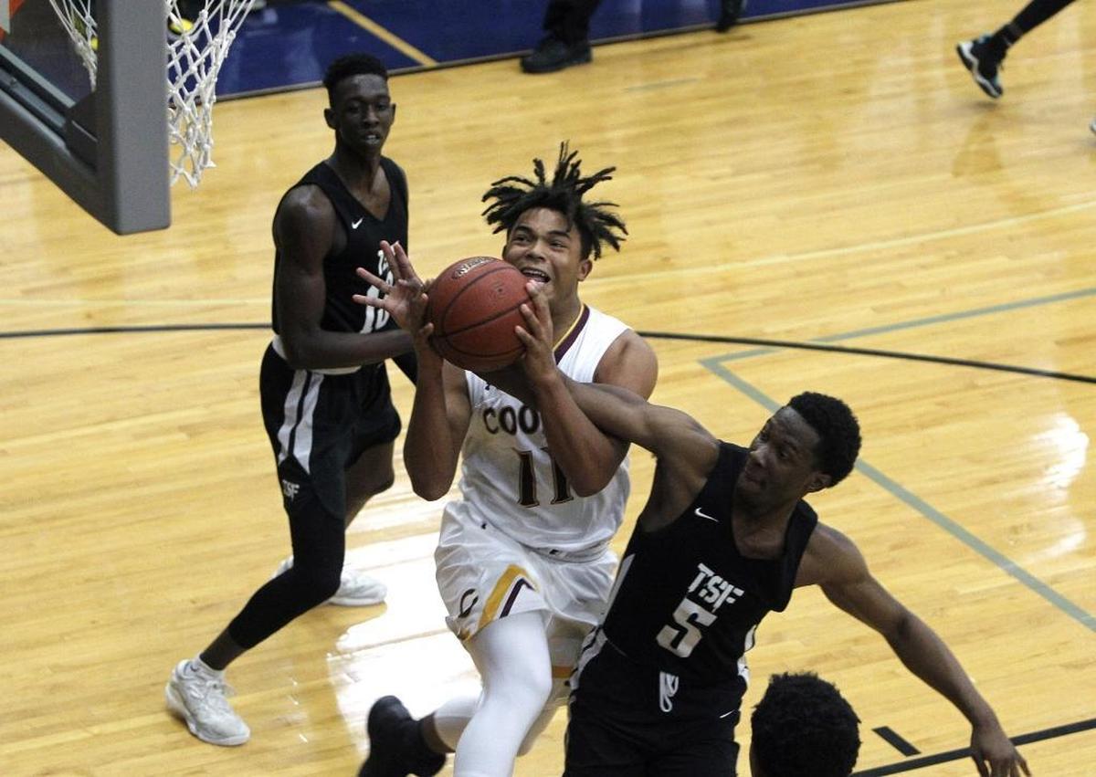 Cooper’s Braydon Runion put up a shot against The Skills Factory (Ga.) during the semifinals of the Traditional Bank Holiday Classic at Lexington Catholic in December.