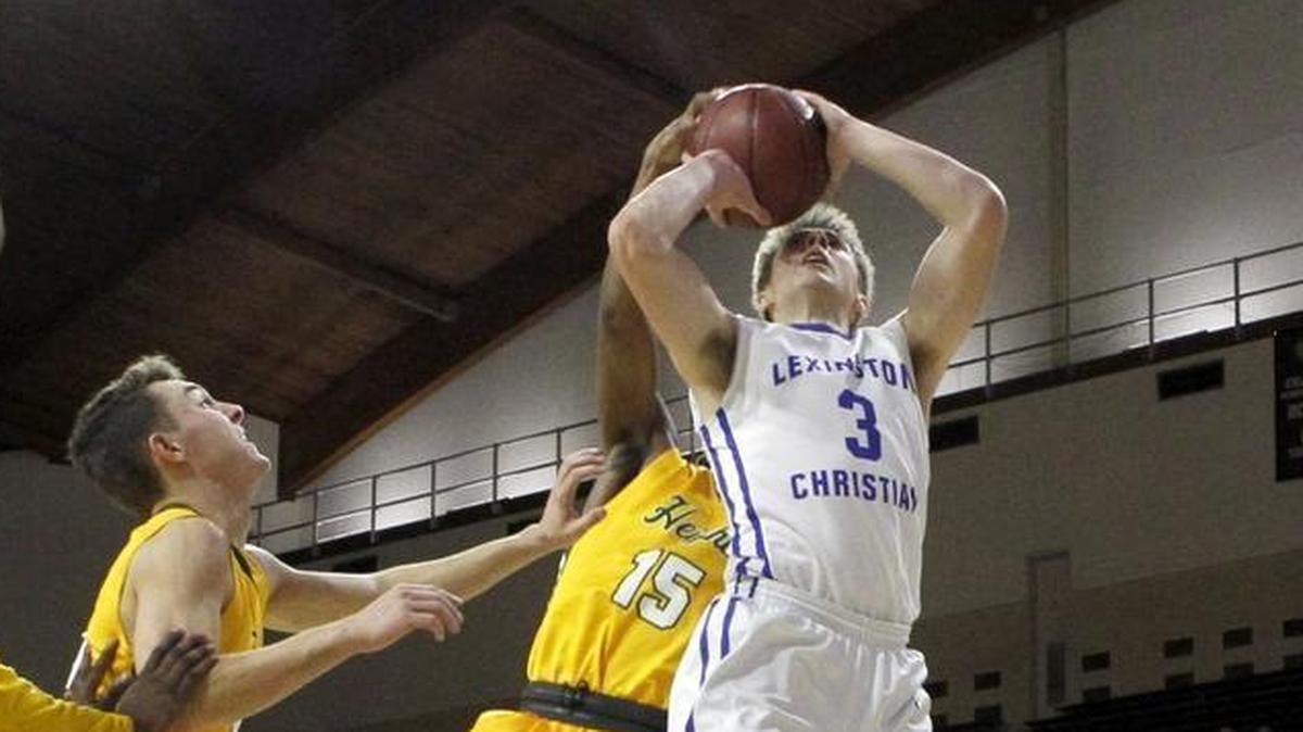 Lexington Christian's Carter Hendrickson shoots and draws the foul against University Heights' Dekeyvan Tandy in the first round of the All 'A' Classic at Alumni Coliseum in Richmond, Ky., Thursday, January 25, 2018.