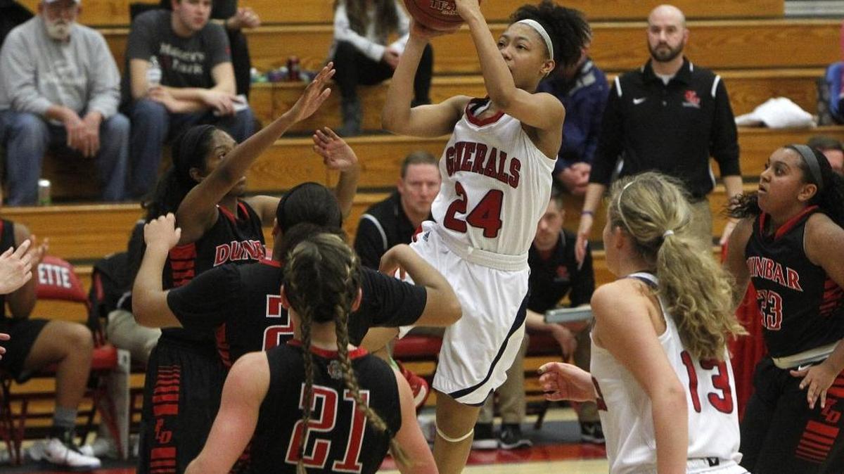 Lafayette's Terri Abram shoots against Paul Laurence Dunbar at Lafayette's gymnasium in Lexington, Ky., Monday, January 16, 2017.