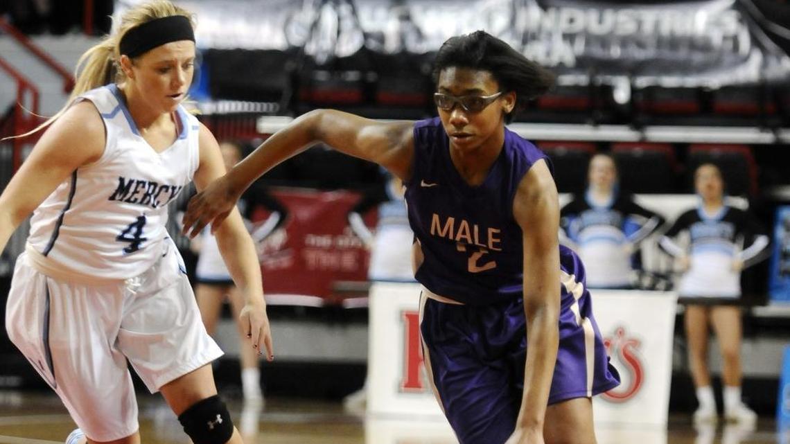 Male's Ciaja Harbison (2) drives against Mercy's Maria Schmitz (4) during a KHSAA Girls' Sweet Sixteen high school girls basketball game, Wednesday, March 11, 2015, at E.A. Diddle Arena in Bowling Green, Ky.