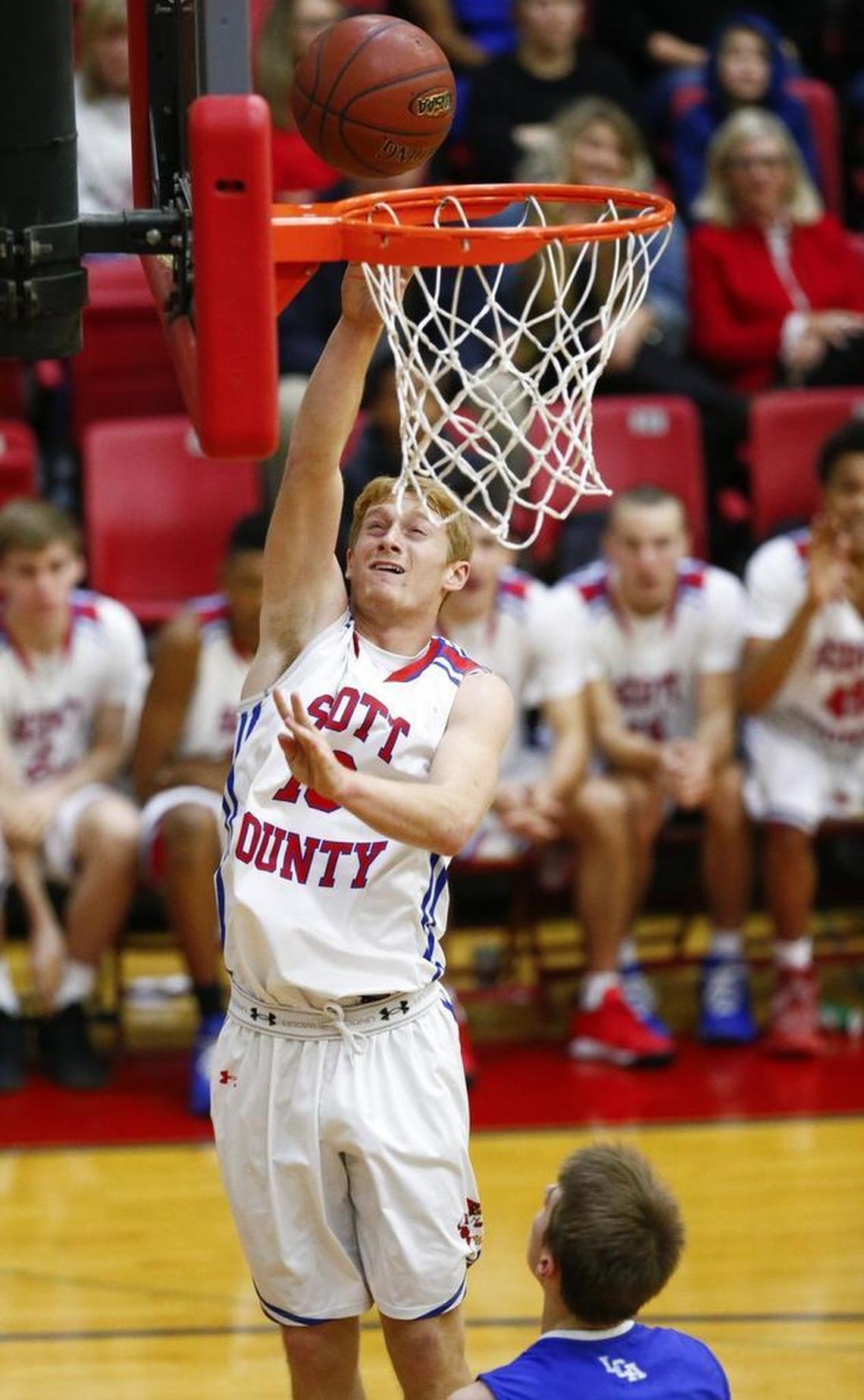 Scott County's Cooper Robb (10) scores past Lexington Christian's Carter Hendrickson (3) during their game at Scott County High School in Georgetown, Ky., Thursday, Dec. 7, 2017. Scott County beat Lexington Christian 68-59.