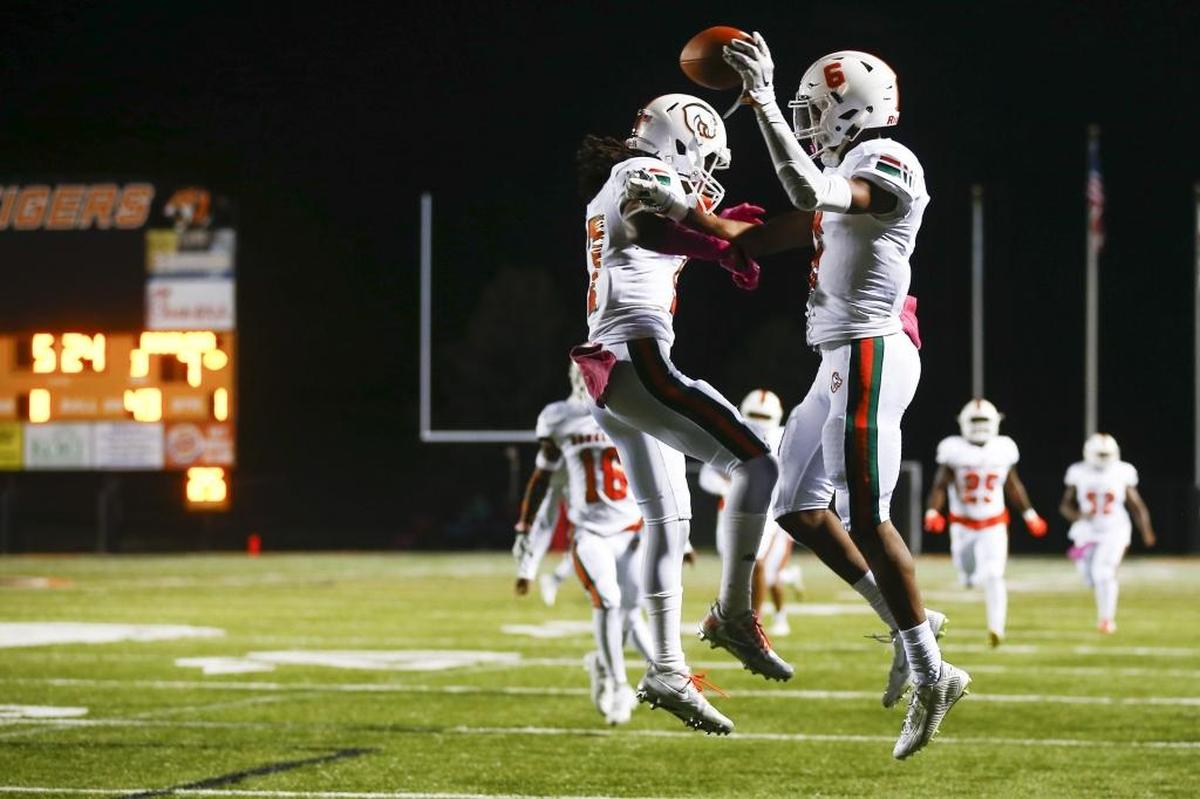 Frederick Douglass' Micah Lowe (17) and Frederick Douglass' Maliq Trigg (6) celebrates a touchdown during their game against Scott County at Toyota Stadium in Georgetown, Ky., Friday, Oct. 6, 2017. Scott County beat Frederick Douglass 55-21.
