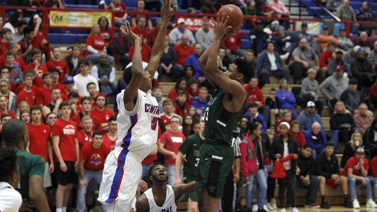 Madison Central's Isaiah Cozart against Trinity's David Johnson at Madison Central gymnasium in Richmond, Ky., Friday, January 26, 2018.