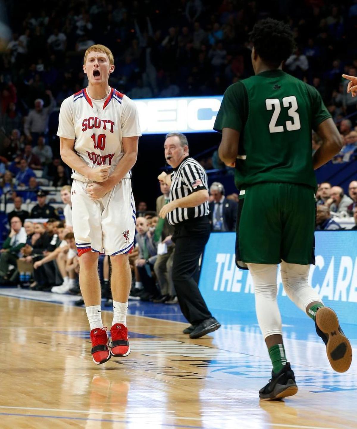Scott County's Cooper Robb reacted to his game winning three-pointer as Scott County played Trinity in an opening round game at the 101st Whitaker Bank/KHSAA Boys' Sweet Sixteen state basketball tournament being played Wednesday at Rupp Arena in Lexington. This is fourth quarter action. Scott Co. won 54-53.