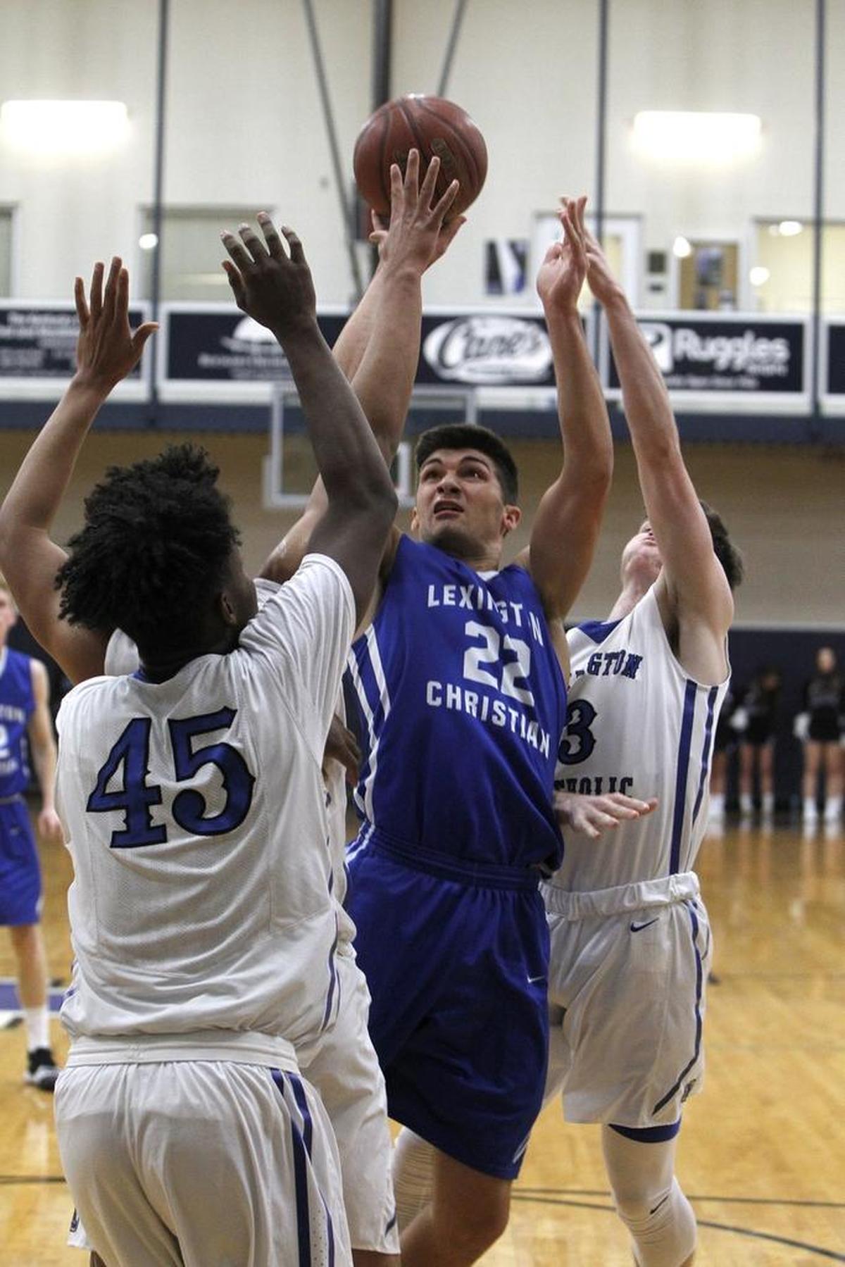 Lexington Christian Academy's Kyle Rode shoots against Lexington Catholic in the Bueter Gymnasium at Lexington Catholic in Lexington, Ky., Tuesday, January 2, 2018.