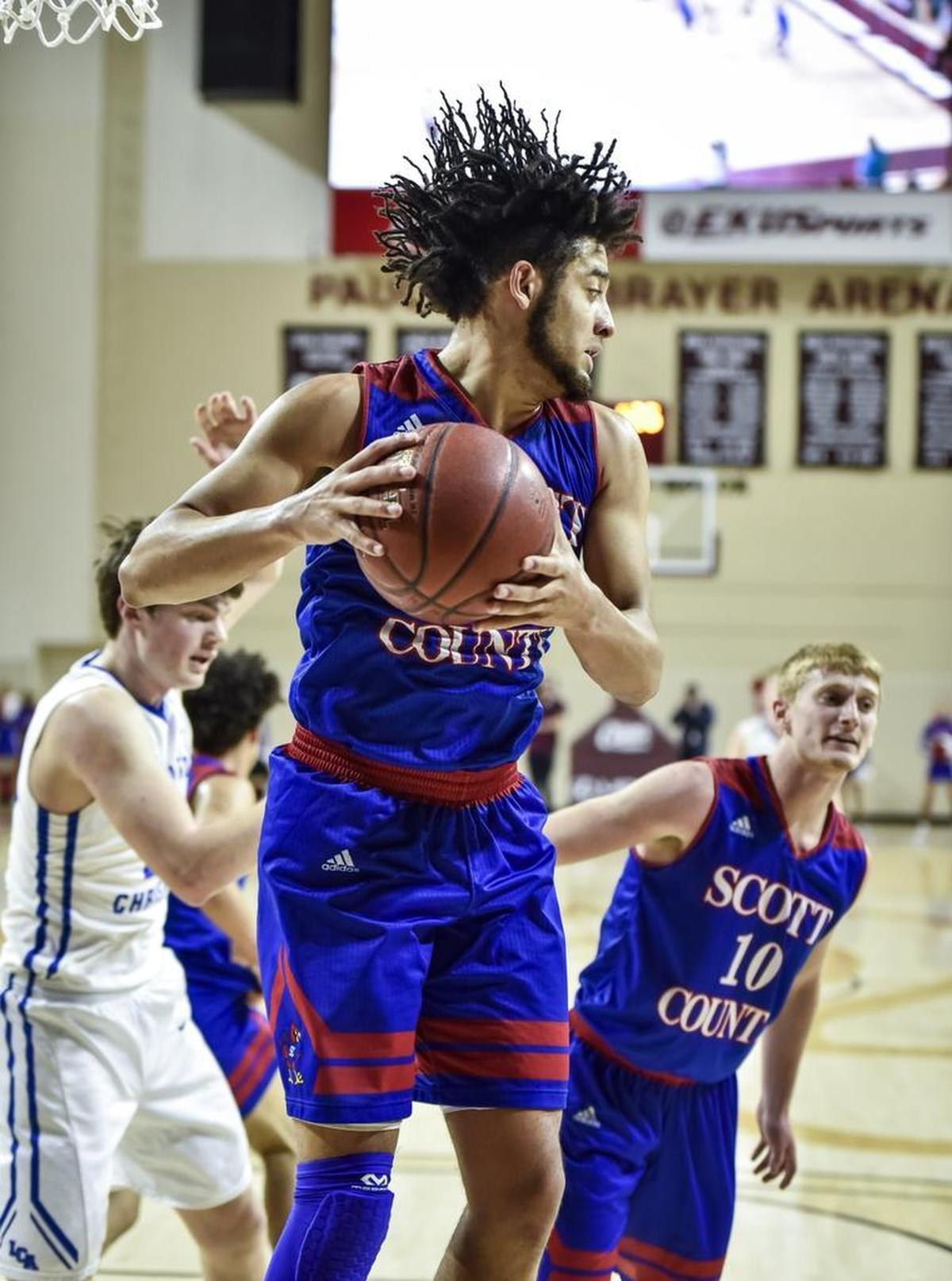 Scott County’s Michael Moreno (24) grabbed a rebound in the fourth quarter against Lexington Christian.