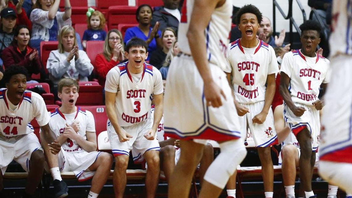 Scott County’s Jaylen Barber (44) Michael Mckenzie (5), KJ Tucker (3), Kobi Harris (45) and Cam Fluker (1) celebrated a basket by teammate Michael Moreno (24). The Cardinals have not lost to a team from Kentucky this season.