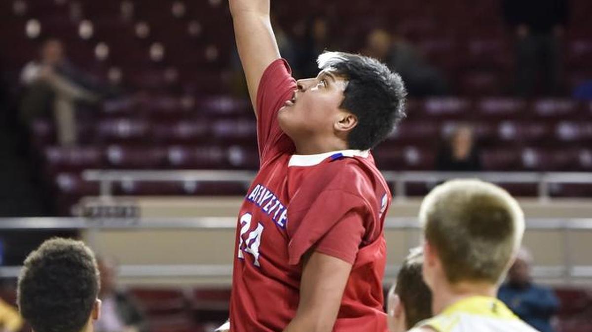 Lafayette's Ray Surratt (34) dunks the ball over Woodford County's Corey George (24), during the first round of the 11th Region tournament, Thursday night, March 1, 2018, at EKU's McBrayer Arena in Richmond.