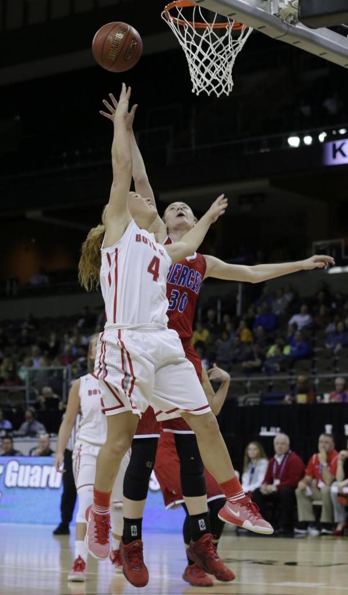 Mercer County Emmy Souder (30) defended the basket from Boyd County Savannah Wheeler (4) in the third quarter of the Boyd County vs Mercer County first round Girls Sweet Sixteen tournament basketball game at BB&T Arena in Highland Heights, Ky, on March 8, 2017.