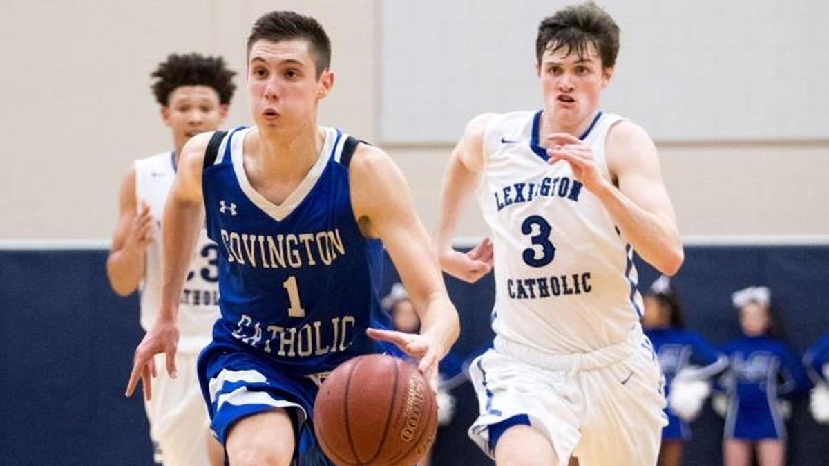 Covington Catholic's CJ Fredrick (1) brought the ball up the floor as host Lexington Catholic came up short 54-53 against Covington Catholic on Wednesday Nov. 29, 2017 in Lexington, Ky.