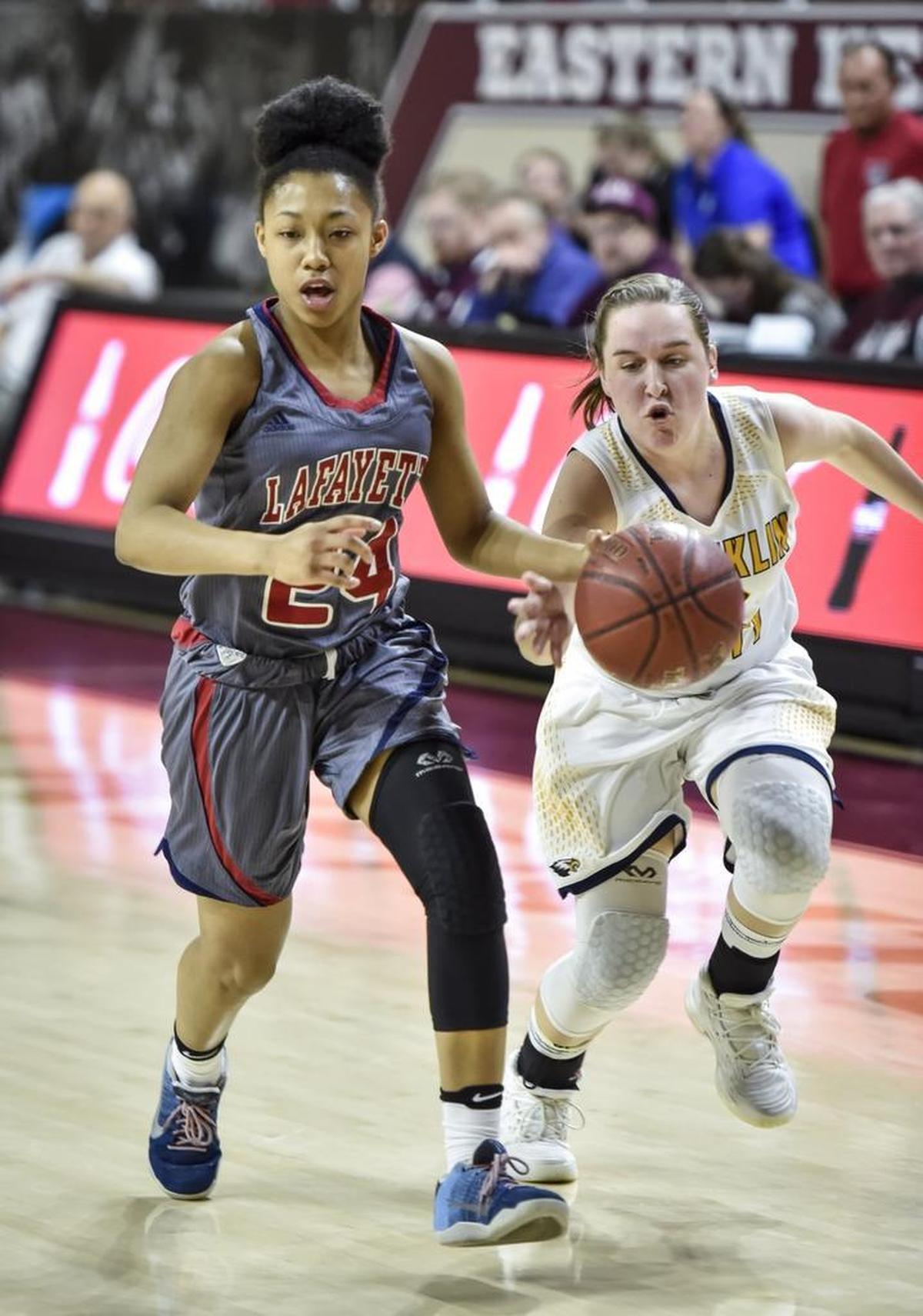 Franklin County's Shannon Brunette (10) attempts to steal the ball from Lafayette's Terri Abram (24), during the semi finals of the 11th Region tournament, Friday night, March 2, 2018, at EKU's McBrayer Arena in Richmond.