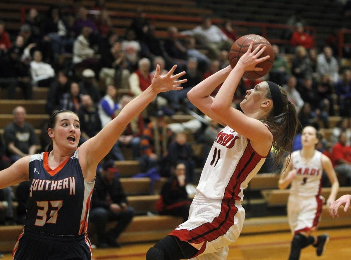 Clark County’s Kennedy Igo shoots against Madison Southern's Marley Lawson in the gymnasium at Campbell Junior High in Winchester, Ky., Friday, February 10, 2017.