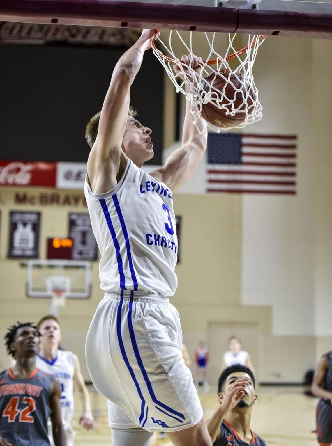 LCA's Carter Hendrickson (3) dunks the ball against Frankfort during the first round of the 11th Region tournament, Wednesday night, February 28, 2018, at EKU's McBrayer Arena in Richmond.