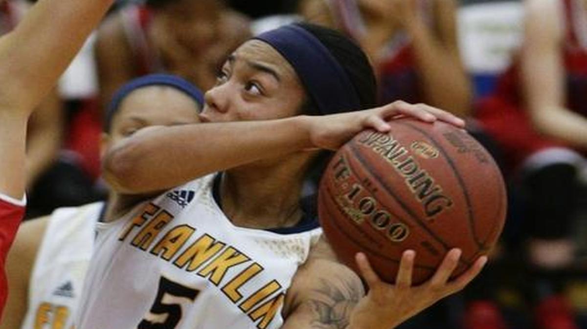 Franklin County's Princess Stewart, 5, scored over Mercey County's Faith Lake, 11, as Mercer Defeated Franklin County 72-63 on Thursday January 12, 2017 in Frankfort, Ky.