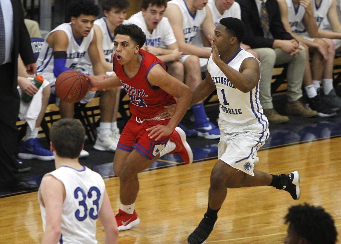 Madison Central's Dustin Geralds moves the ball with pressure from Lexington Catholic's Javen Hardin Tuesday at Lexington Catholic.
