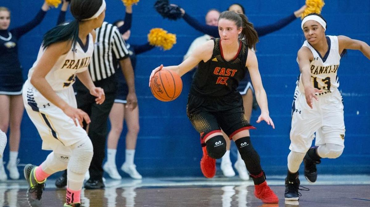 Bullitt East’s Lindsey Duvall (12) drove the ball as Bullitt East defeated Franklin County 72-61 on Monday Feb. 15, 2016 in Frankfort, Ky.