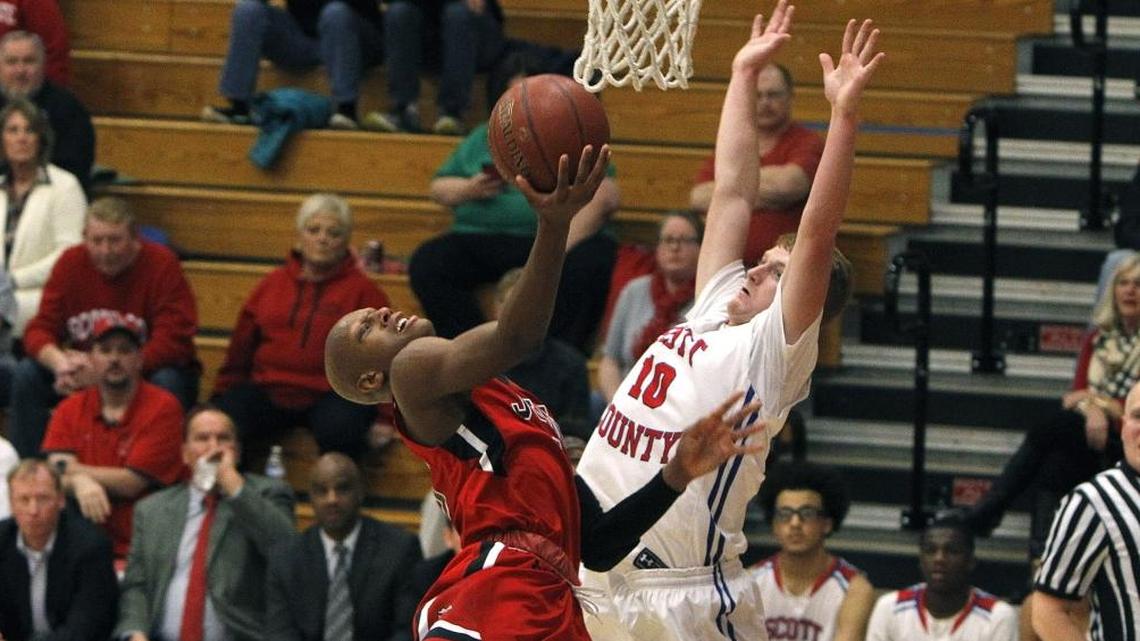John Hardin's Mickey Pearson shoots against Scott County's Cooper Robb Saturday during the Jock Sutherland Classic at Lafayette High School.