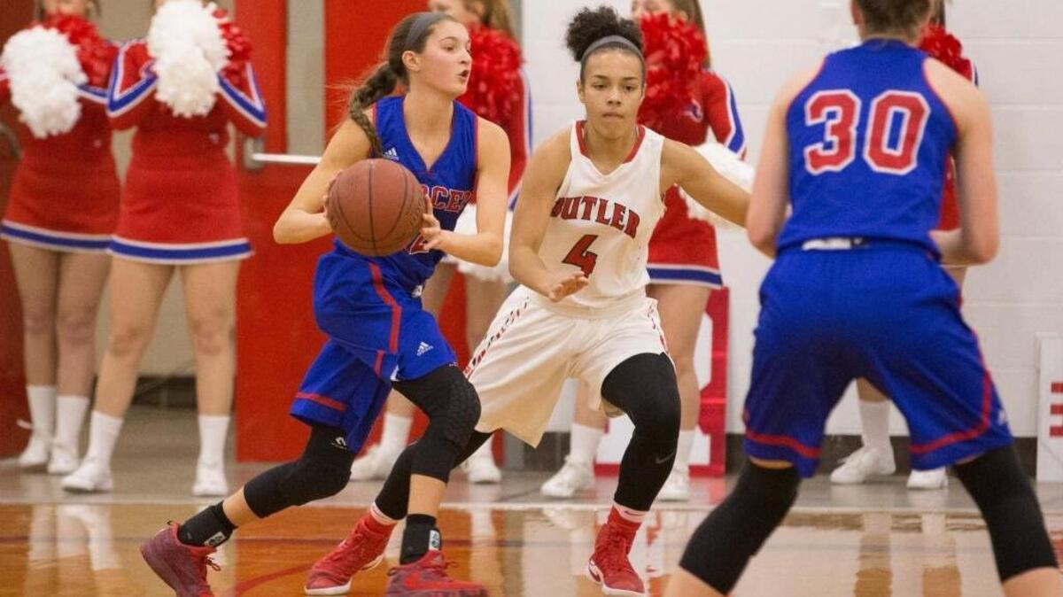 Mercer County Titans guard Lexy Lake (12) drives the ball during the Girls Basketball game between Mercer County and Butler at Butler high school in Louisville, Ky.