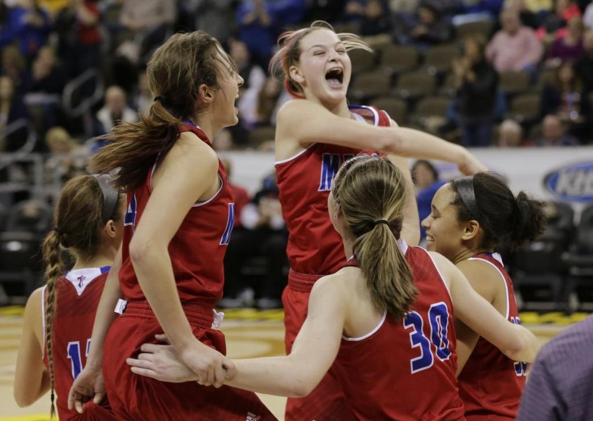 Mercer County's Emma Davis (0) and her team celebrated as the clock ran out in the fourth quarter of the the Murray vs Mercer Co. Girl's Sweet 16 semifinal basketball game at BB&T Arena in Highland Heights, Ky, on March 11, 2017. Mercer Co. beat Murray 67-60.