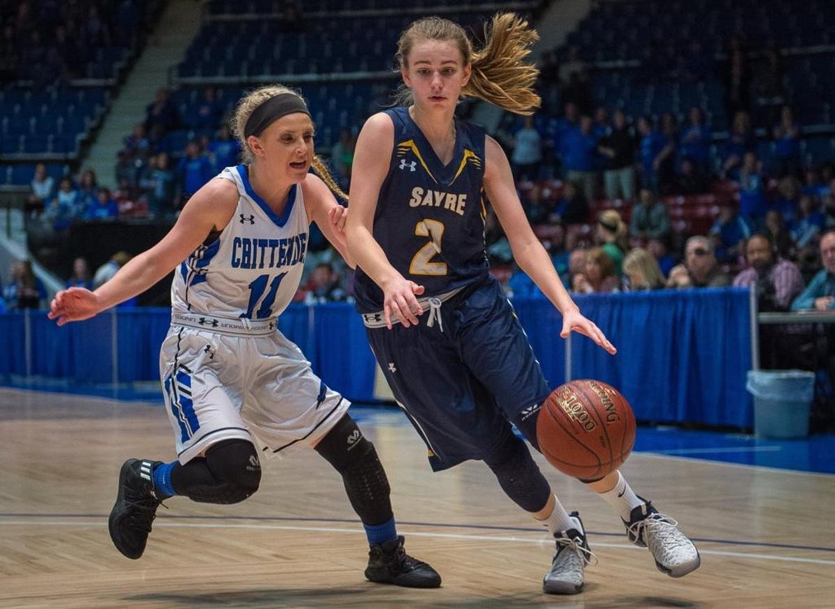 Sayre's Dee Dee Wheeler drives past Crittenden County's Mauri Collins during the fourth quarter of the All "A" Tournament opening round game at the Frankfort Convention Center in Frankfort, Kentucky.