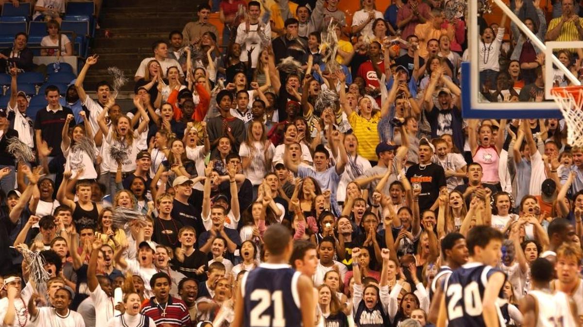 Warren Central fans cheer for their team against Male as Warren Central takes the lead late in the second half of Game 2 of the Boys' Sweet Sixteen Quarterfinals at Rupp Arena. Warren Central loses in overtime 67-73. Friday March 15, 2002