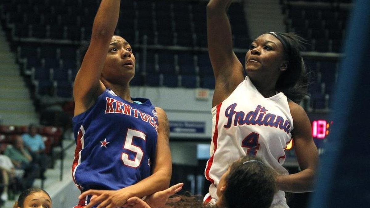 Kentucky's Princess Stewart shoots against Indiana's Dana Evans in the Kentucky-Indiana All-Stars girls' game at Frankfort Convention Center in Frankfort, Ky., Sunday, June 11, 2017.
