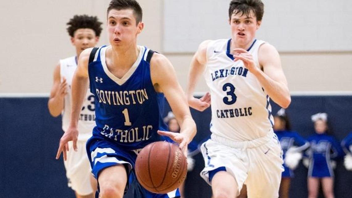 Covington Catholic’s CJ Fredrick (1) pushed the ball up the court against Lexington Catholic on Nov. 29, 2017.