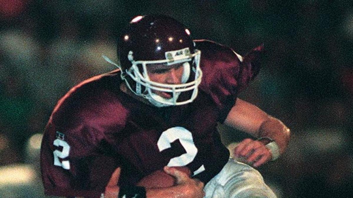 Tim Couch of Leslie County ran through the tackle of Highland's Maynard Johnson in the first half of the Thoroughbred Bowl at Tates Creek High School in Lexington Saturday August 26, 1995. Leslie County upset Highlands 44-42 behind Couch's 17 for 30 passes for 287 yards and three touchdowns and ran for 112 yards and three touchdowns.