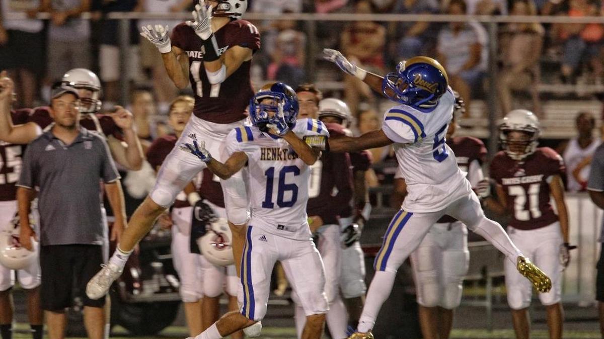 Tates Creek’s Jackson Beermna pulled down a 35 yard pass over Henry Clays Michael McMullen,16, as Tates Creek played Henry Clay on Friday September 9, 2016 in Lexington, Ky.