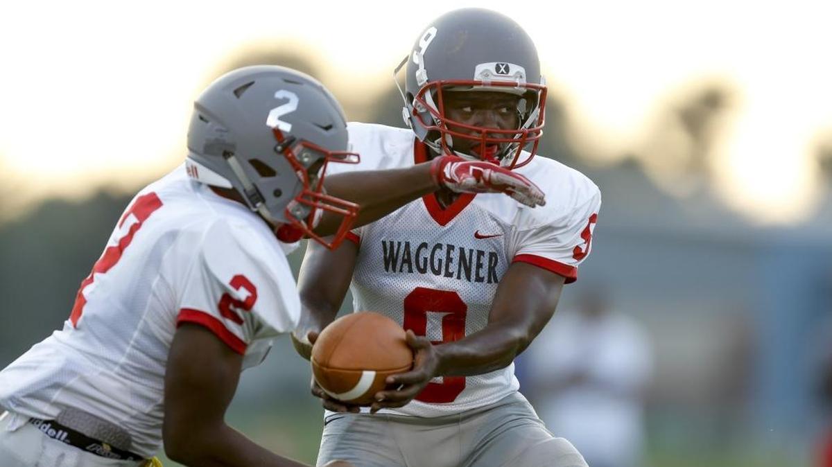 Waggener quarterback Jairus Brents hands the ball off to running back Brandon Jones against Lexington Christian at Lexington Christian Academy in Lexington, KY., on Saturday, August 19, 2017.