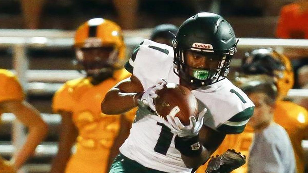 Western Hills' Wandale Robinson (1) intercepts a ball intended for Woodford County's Benjamin Nash (6) during their game at the Woodford County football stadium at Falling Springs in Versailles, Ky., Friday, Sept. 22, 2017.