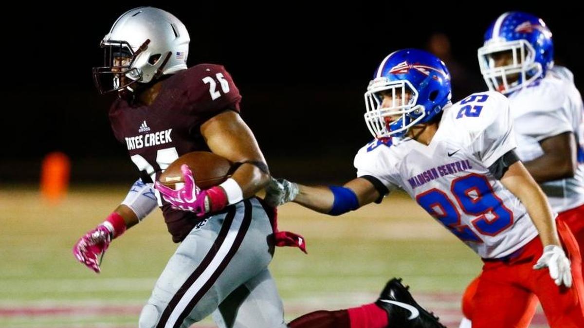 Tates Creek running back Teonte White, left, ran past Madison Central's Denton Witt during the No. 24 Commodores’ 17-10 victory on Oct. 5. White had 92 yards and a touchdown in Tates Creek’s 21-7 victory over city rival Lafayette this past weekend. White and Laron Warner have combined for more than 1,000 yards on the ground for Tates Creek this season.