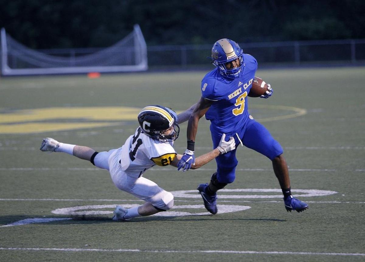 Henry Clay's Langston Jackson breaks the tackle by Johnson Central's Dillon Preston at Henry Clay in Lexington, Ky., Thursday, August 31, 2017.
