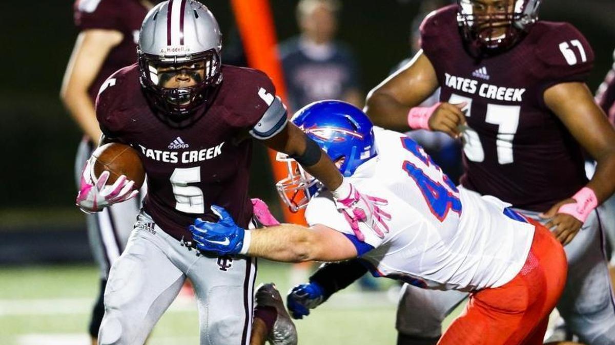 Tates Creek's Laron Warner, left, ran the ball against Madison Central during a 17-10 win on Oct. 5. Warner and teammate Teonte White combined for 254 yards rushing and five touchdowns in the No. 25 Commodores’ 53-14 victory over Bryan Station this past weekend.
