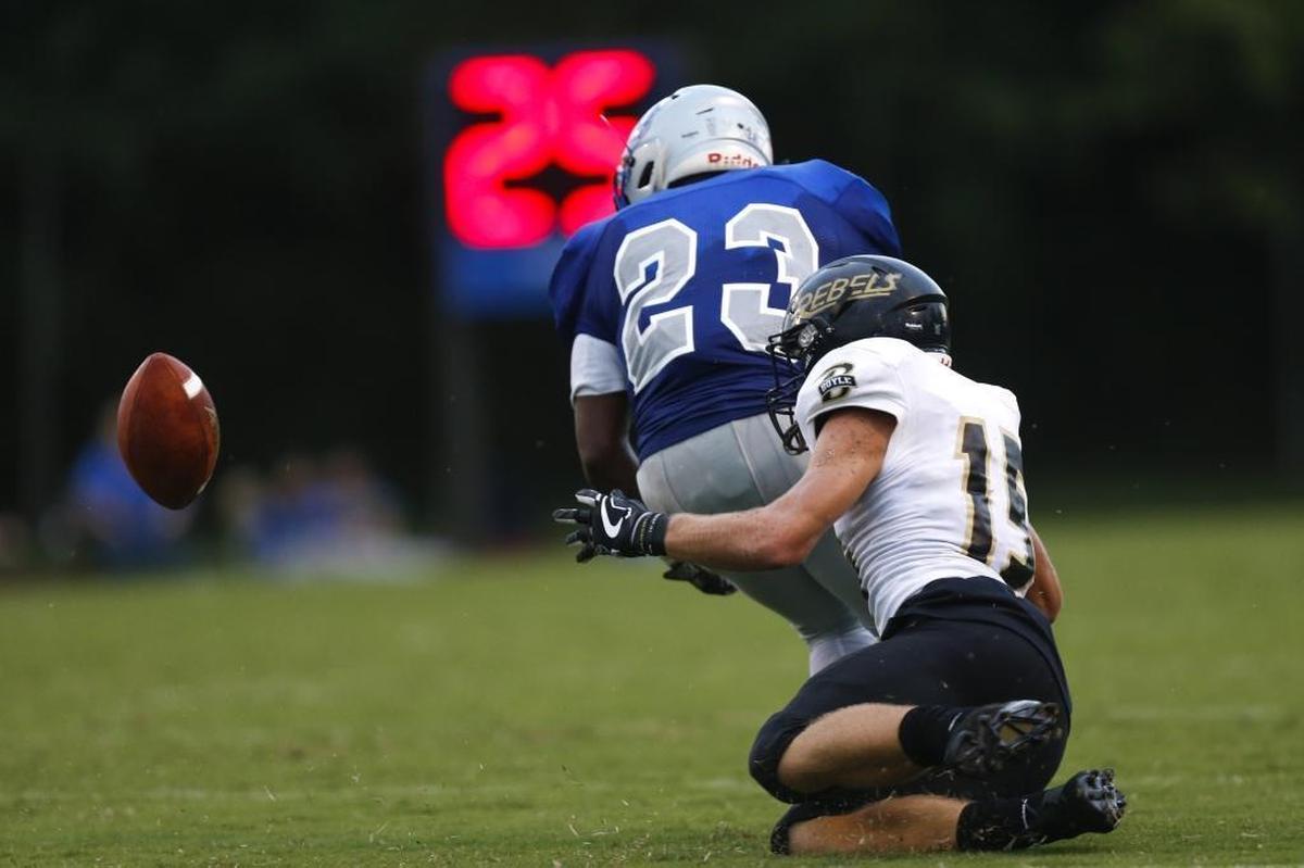 Danville Admirals running back Donleavy Harris #23 fumbles by Boyle County Rebels defensive back Reese Smith #15 at Danville Admirals Stadium in Danville, Ky., on Thursday, August 31, 2017.