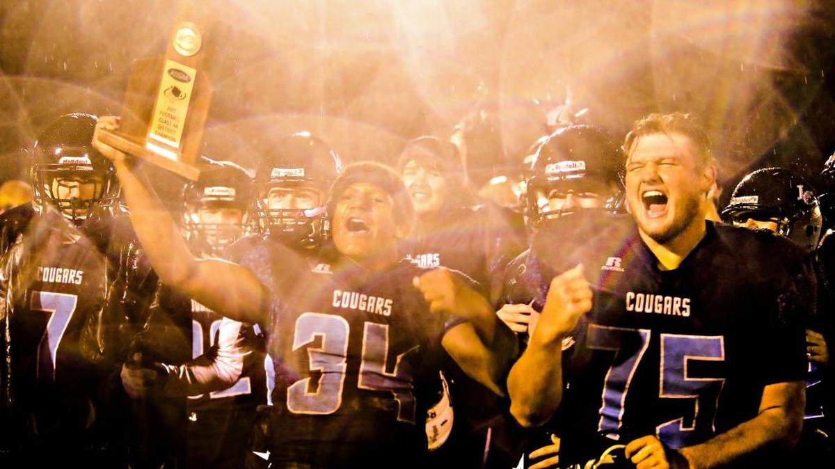 Logan County’s Gary Hardy (34) and Caden McKinnis (75) celebrated after their 34-6 win over Todd County Central on Oct. 27 at Logan County.