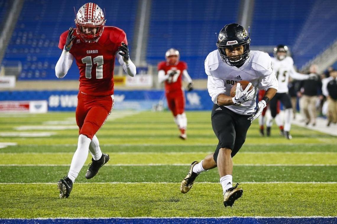 Boyle County's Reiley Colwick (9) scores a touchdown past Corbin's Caleb Mitchell (11) during the Class 3A Russell Athletic/KHSAA Commonwealth Gridiron Bowl championship game at Kroger Field in Lexington, Ky., Friday. Dec.1, 2017. Boyle County beat Corbin 40-21.