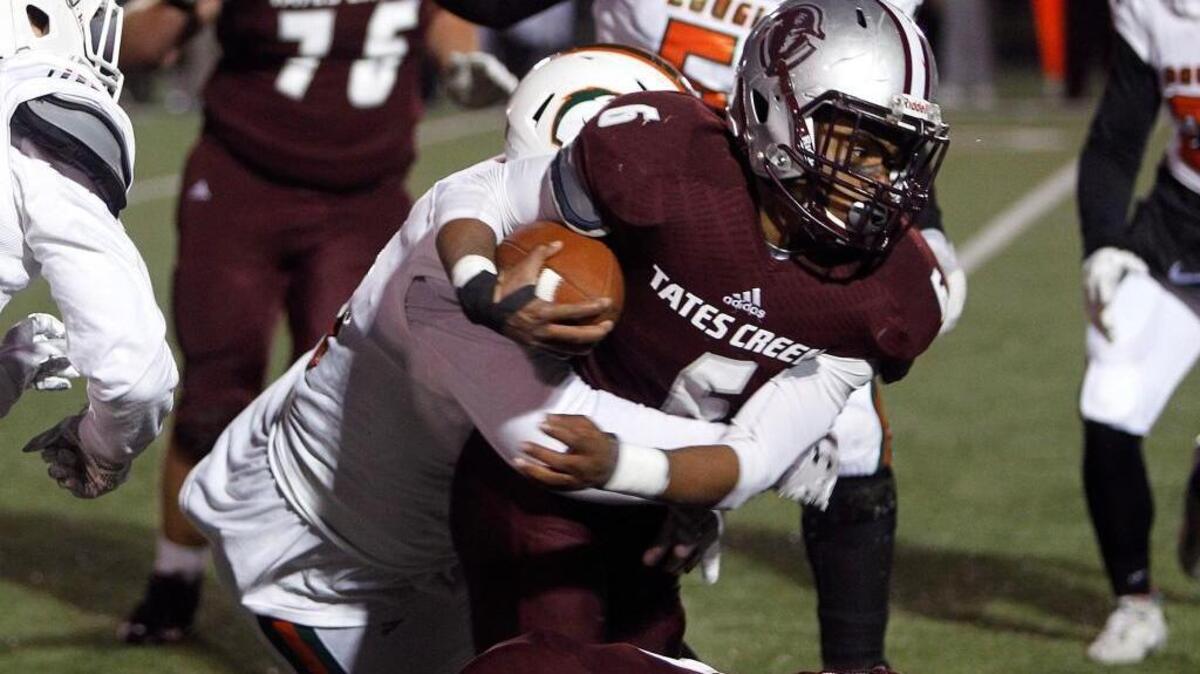 Tates Creek running back Laron Warner (6) scored two touchdowns against Frederick Douglass in the state playoffs on Nov. 10. Warner, who eclipsed 1,000 yards rushing and scored 14 touchdowns this season, was voted district player of the year.