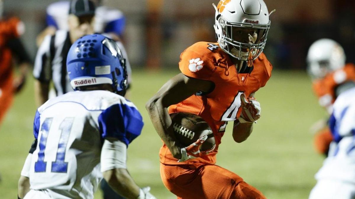 Paris receiver Jekobi Wells, 4, ran for yardage after a catch as Paris played Bracken County on Friday September 30, 2016 in Paris, Ky.