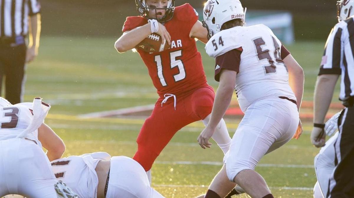 Dunbar quarterback Gavin Bugg, cut back for a first down on a 4th and 2 as Dunbar played Tates Creek on Friday September 2, 2016 in Lexington, Ky.