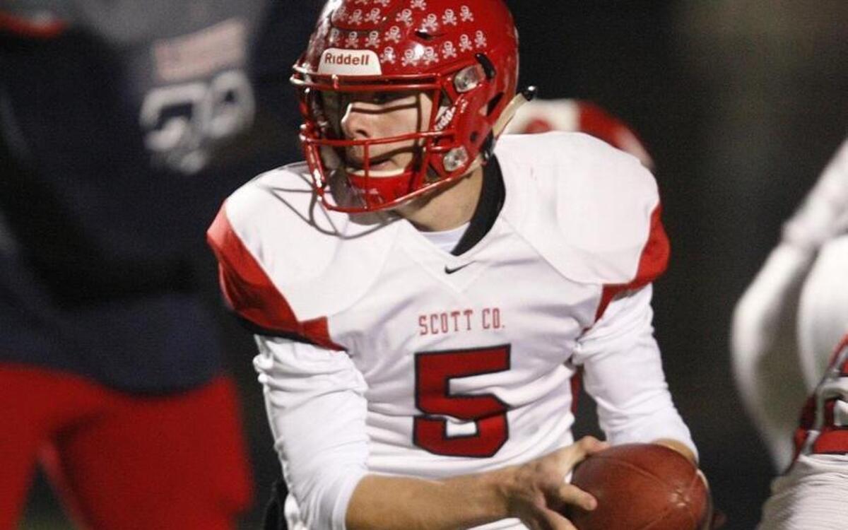 Scott County quarterback Josh Davis hands off against Lafayette in the KHSAA Class 6A sate semifinals at Ishmael Stadium in Lexington, Ky., Friday, November 25, 2016.