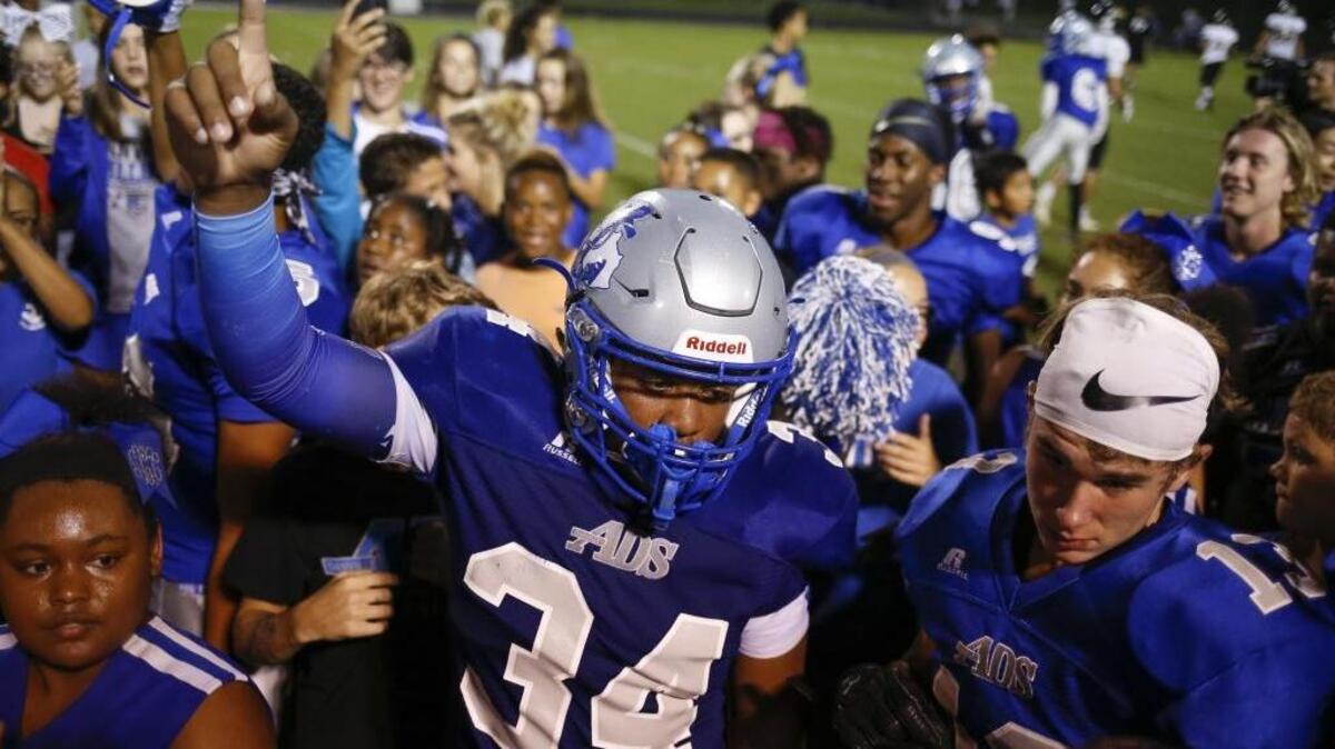 Danville Admirals linebacker Darrian Bell #34 celebrates with fans after they defeated the Boyle County Rebels 10-7 at Danville Admirals Stadium in Danville, Ky., on Thursday, August 31, 2017.